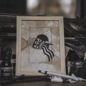 Tableau Astro Verseau AstroGomme - Illustration du signe Verseau à l’encre de chine sur papier teinté au café, cade 15 x 20cm